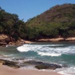 Menikmati Gelombang Halus di Pantai Mrutu (C) WIKIMAPIA